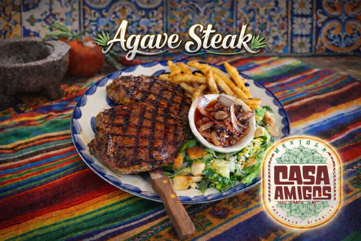 Grilled agave steak with fries and salsa served on a colorful plate, Casa Amigos restaurant logo visible